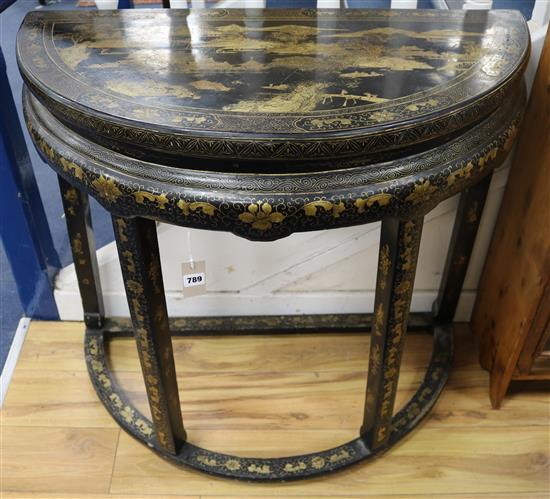 A late 19th century Chinese black lacquered side table with gilt decoration 90cm